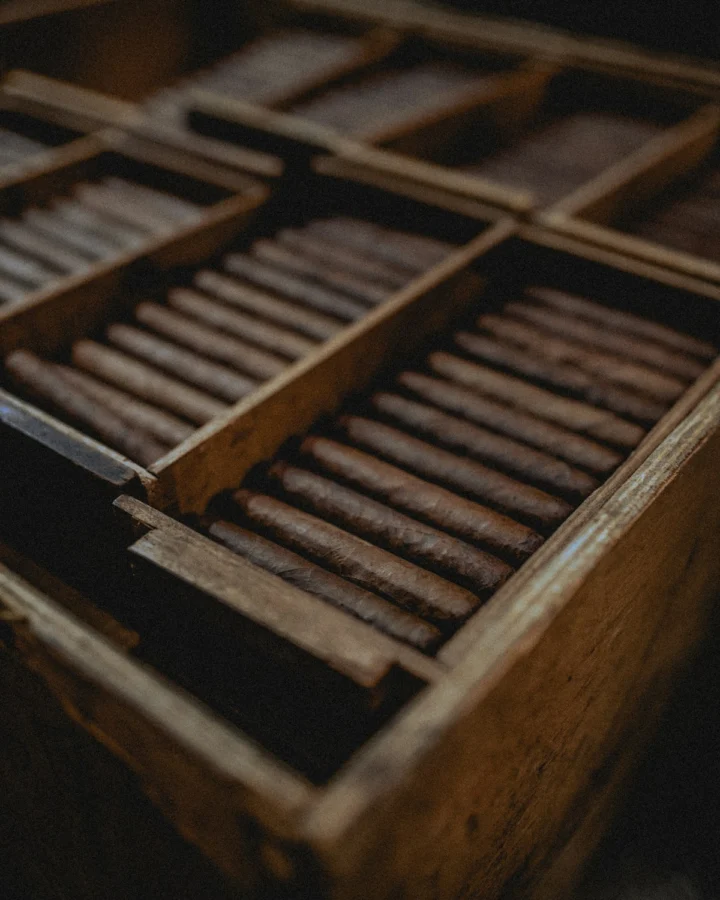 Hand-rolled cigars resting on a wooden surface